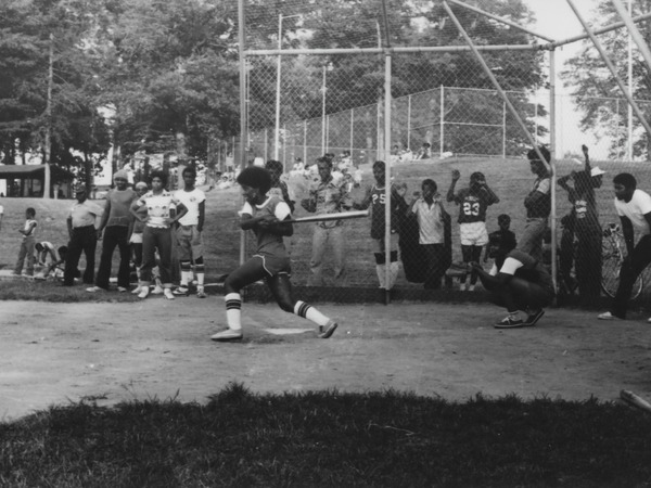 Woman playing softball at Johnsons Local Park